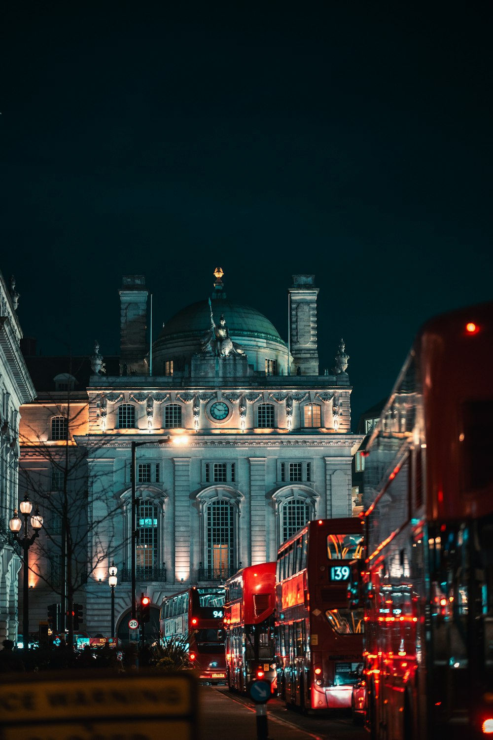 a large white building with a lot of lights on it