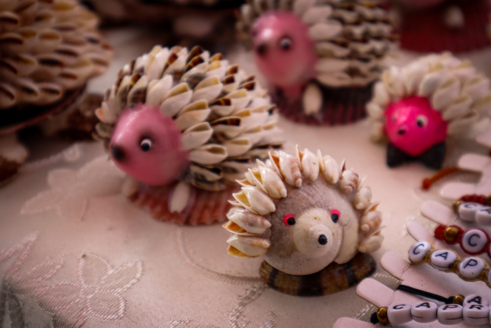 a table topped with lots of cupcakes covered in frosting