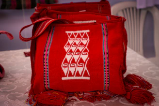 a red bag sitting on top of a table