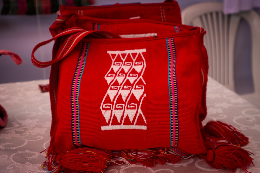 a red bag sitting on top of a table