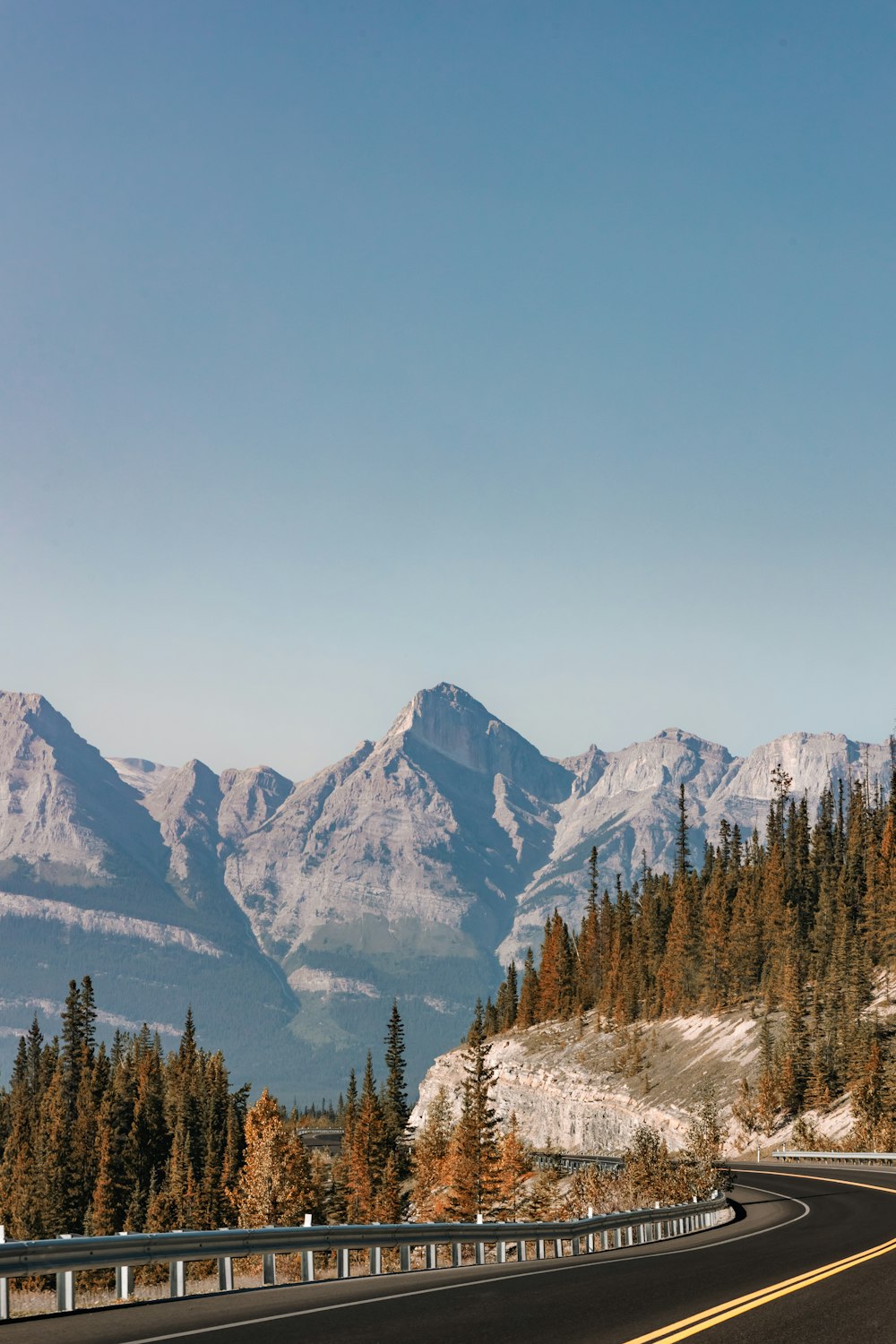 a road with a mountain range in the background