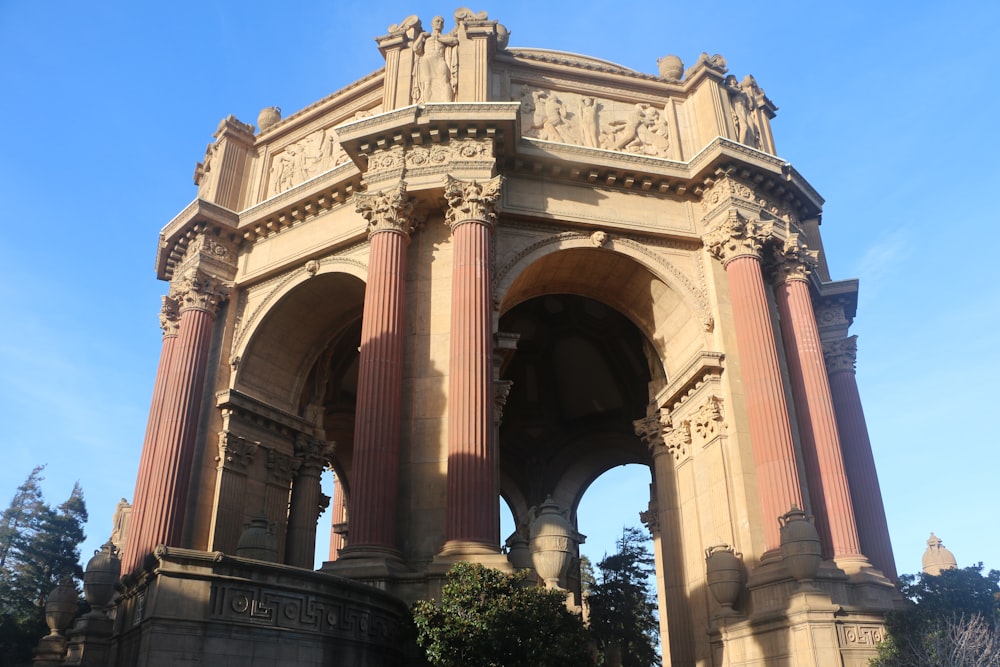 a large stone structure with pillars and arches