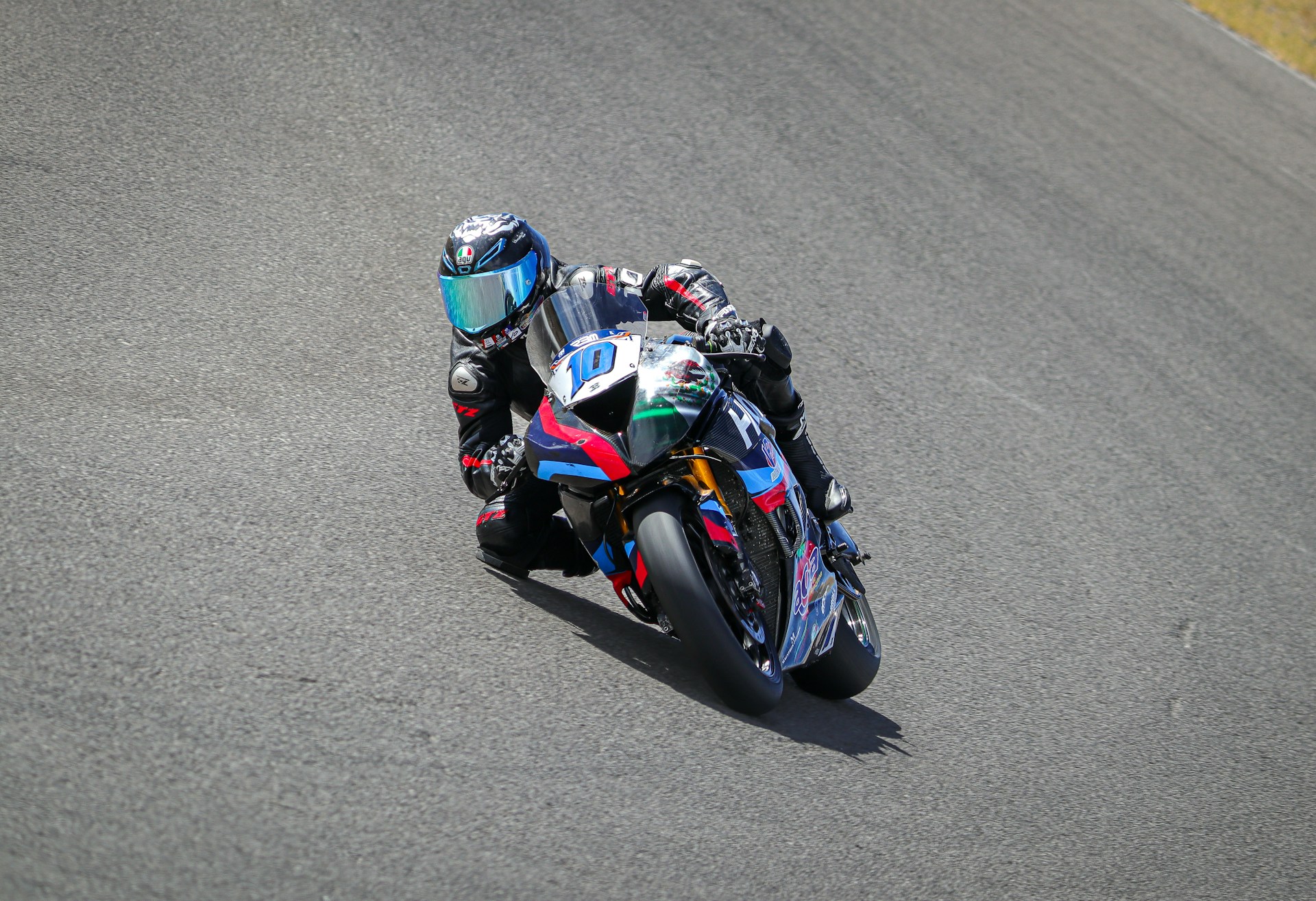 a person riding a motorcycle on a race track