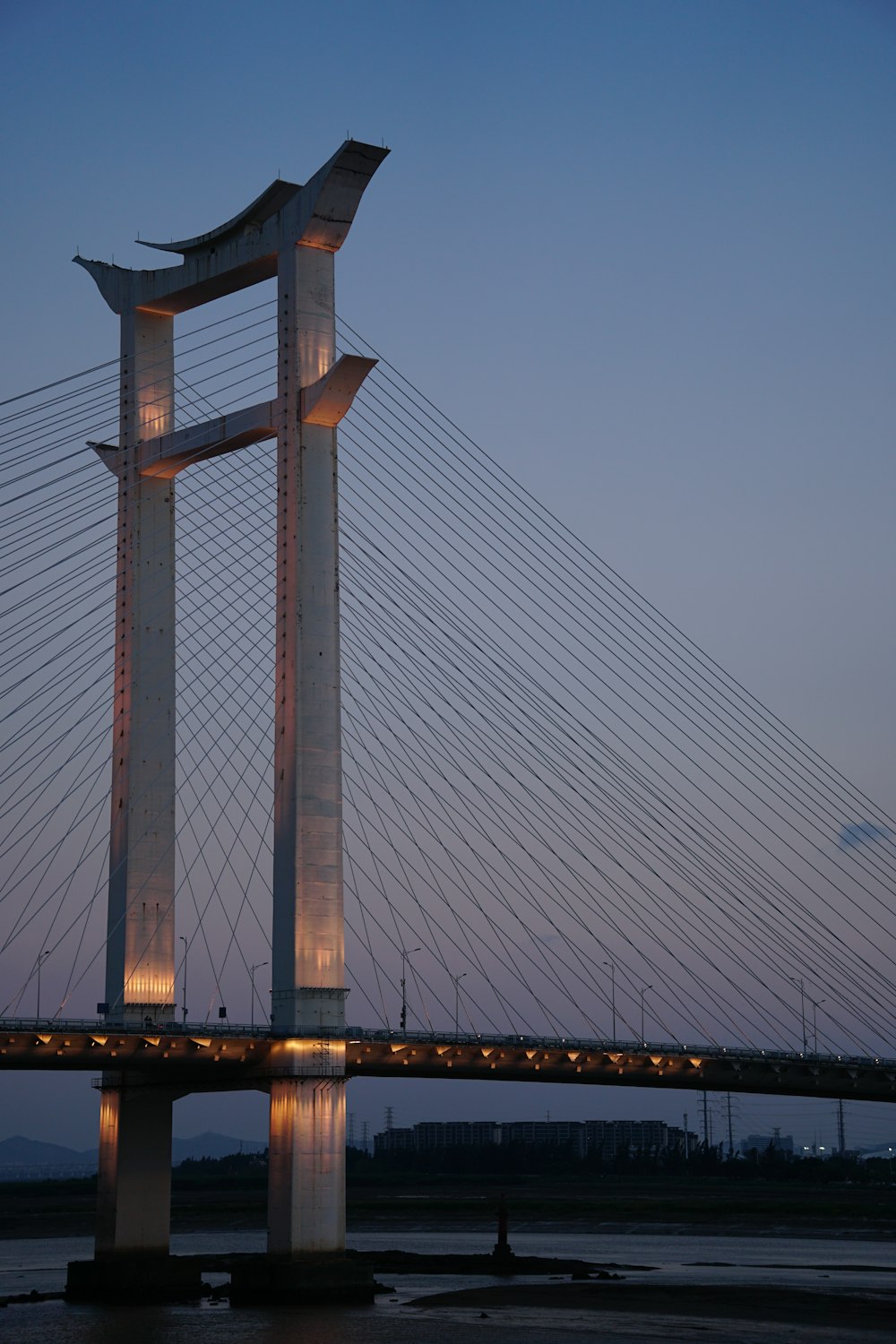 a tall bridge with lights on it's sides