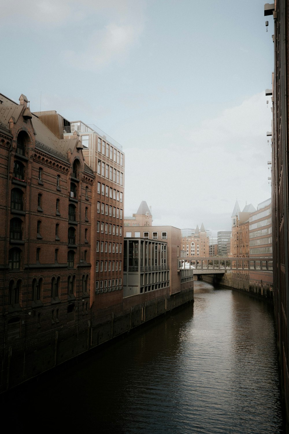 a river running through a city next to tall buildings