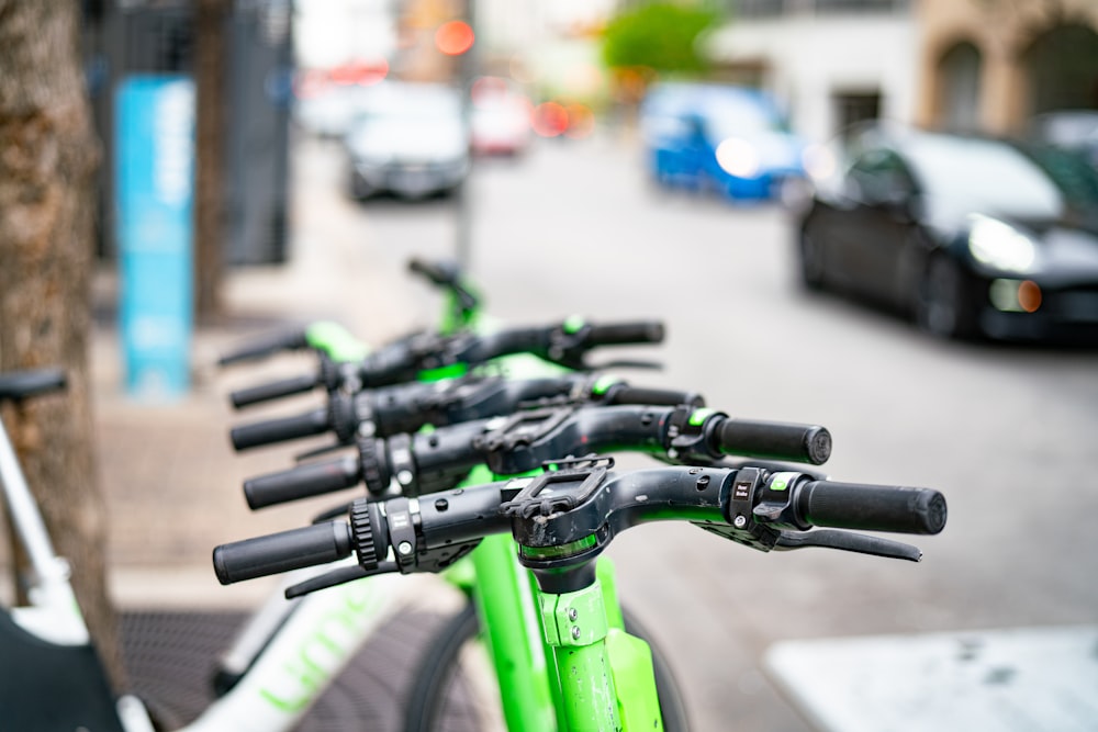 a row of bikes parked on the side of a street