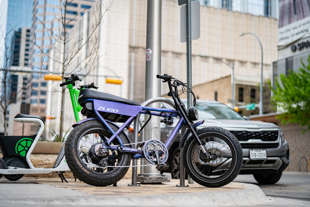 a motorcycle parked next to a scooter on a city street