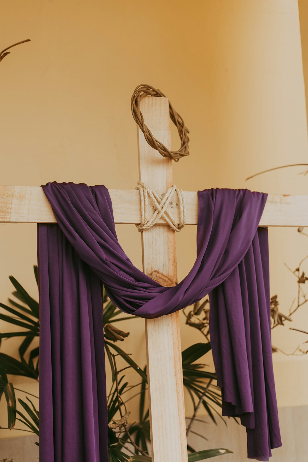 a cross with a purple cloth draped over it