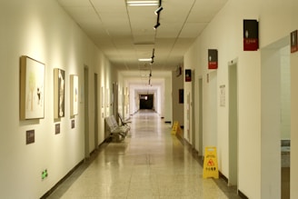 a long hallway with pictures on the walls