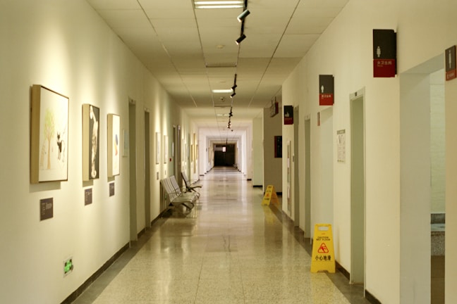 a long hallway with pictures on the walls