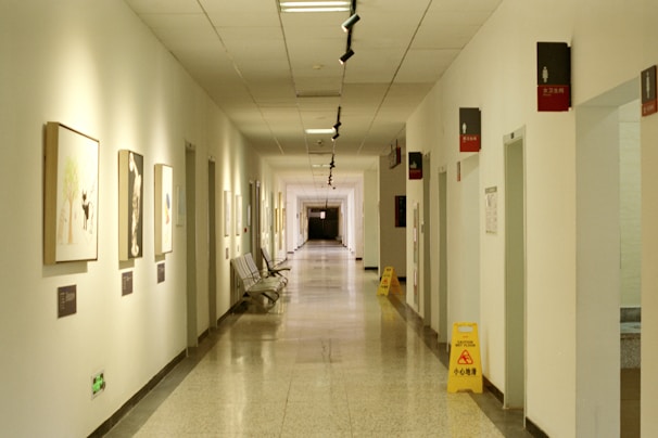 a long hallway with pictures on the walls