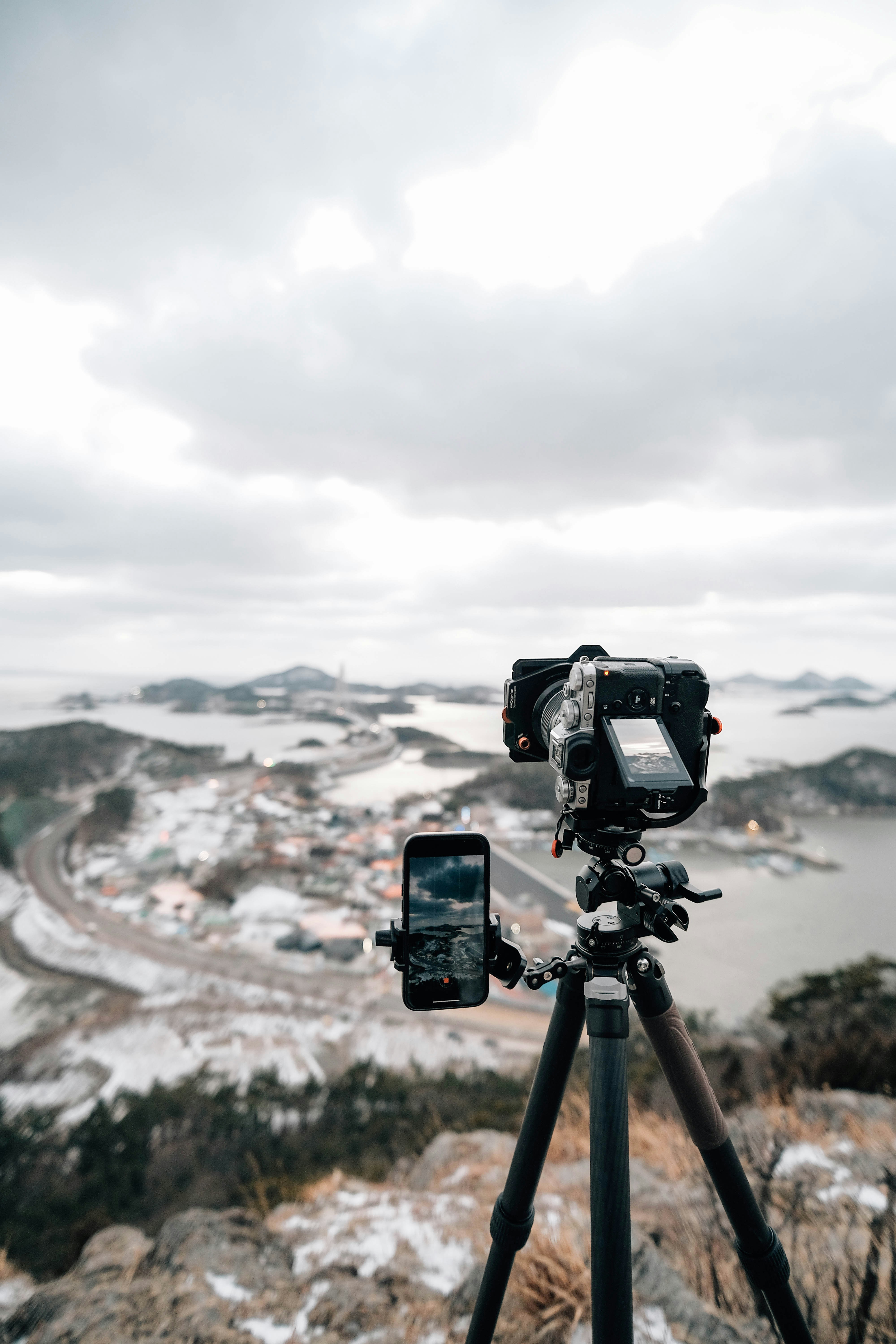 a tripod with a camera on top of it