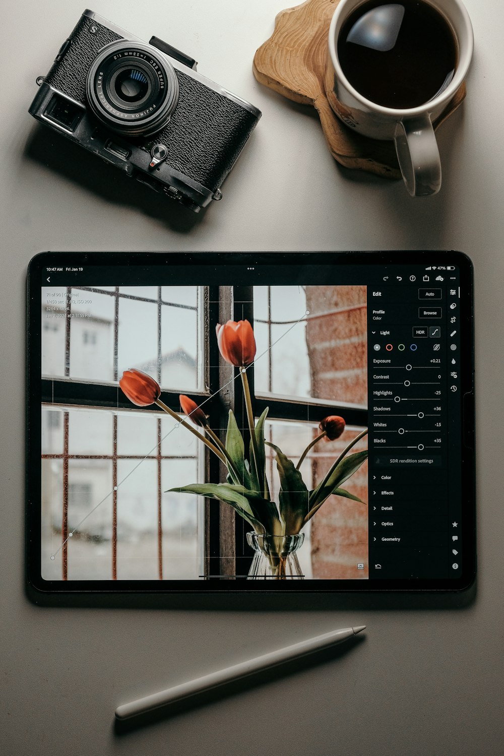 a tablet with a picture of tulips and a camera