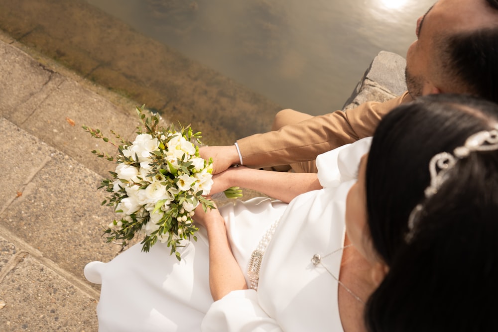 a man and a woman sitting next to each other