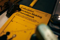a calculator decision - making sourcebook with a calculator next to