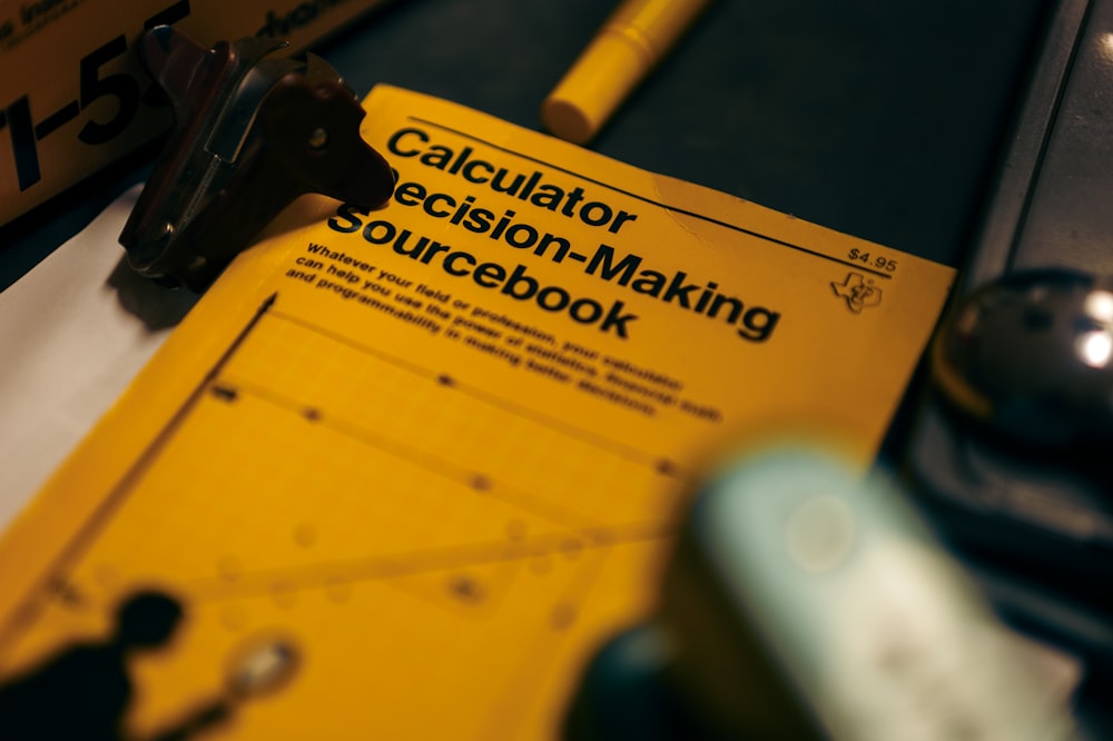 a calculator decision - making sourcebook with a calculator next to