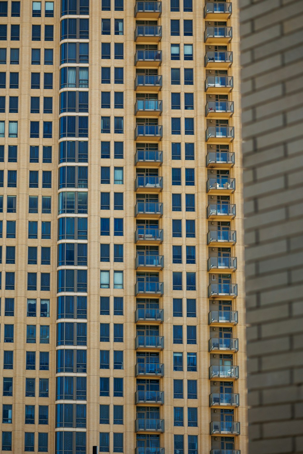 a tall building with balconies on the top of it