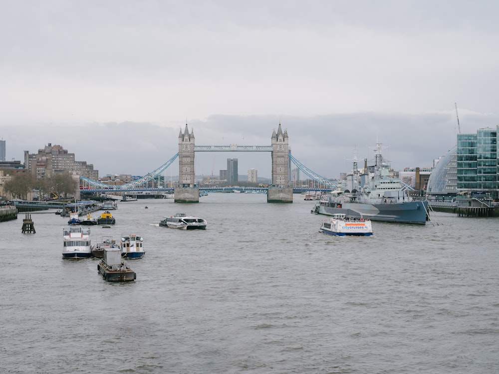 a group of boats floating on top of a river