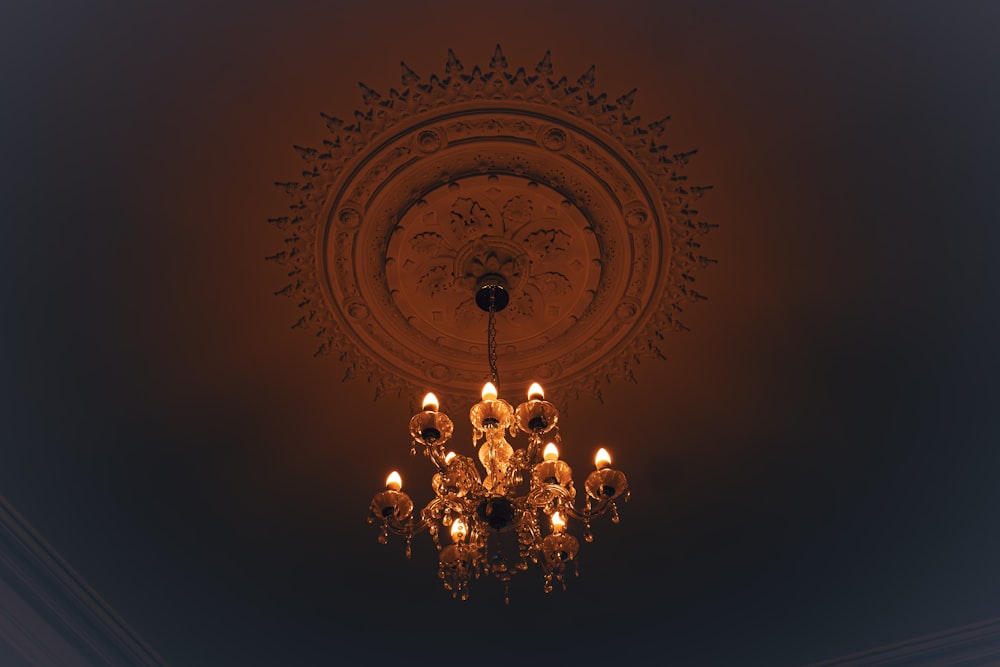 a chandelier hanging from the ceiling in a dark room