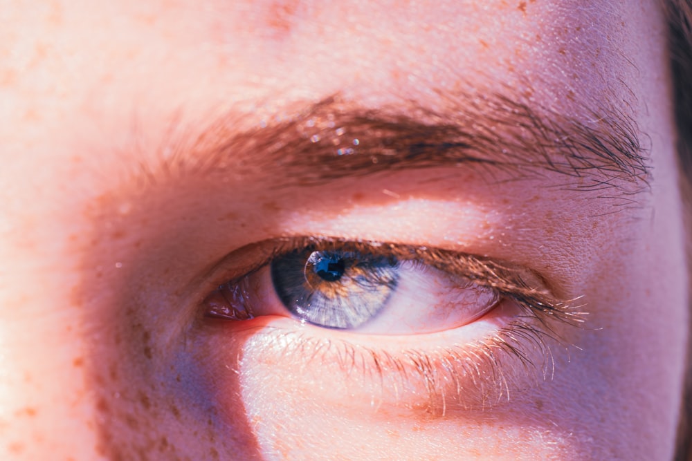 a close up of a person's blue eye