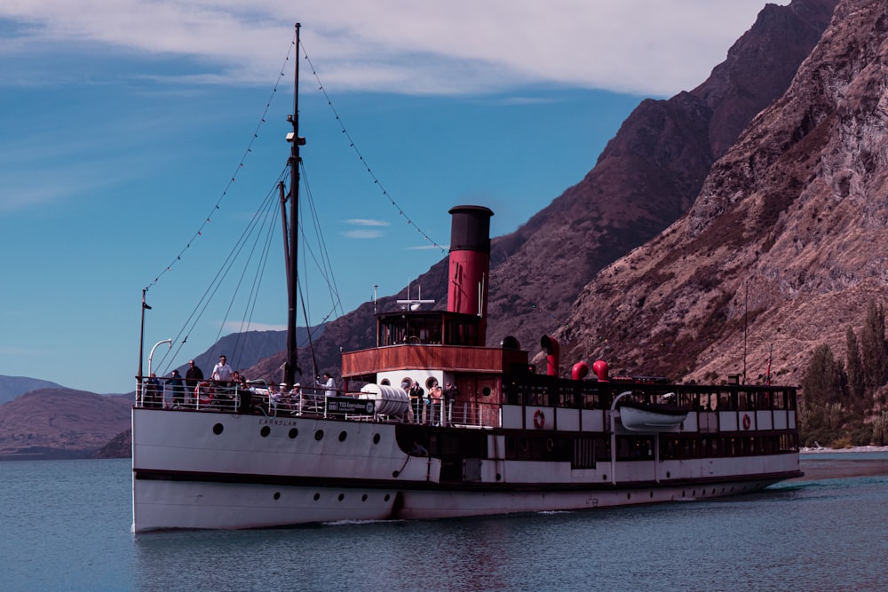 a large boat floating on top of a body of water