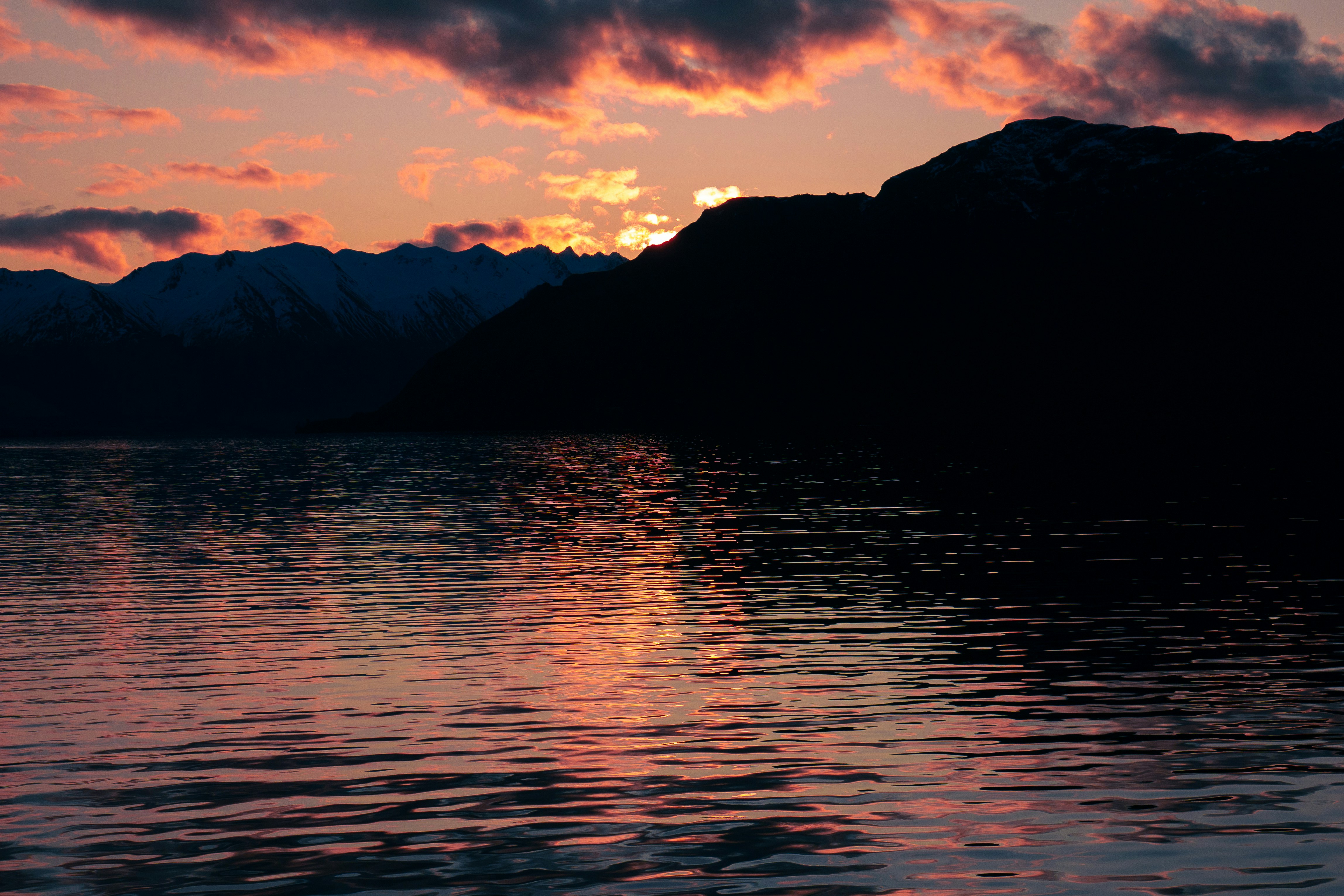 The sun is setting over a mountain range photo Free Sky Image on Unsplash