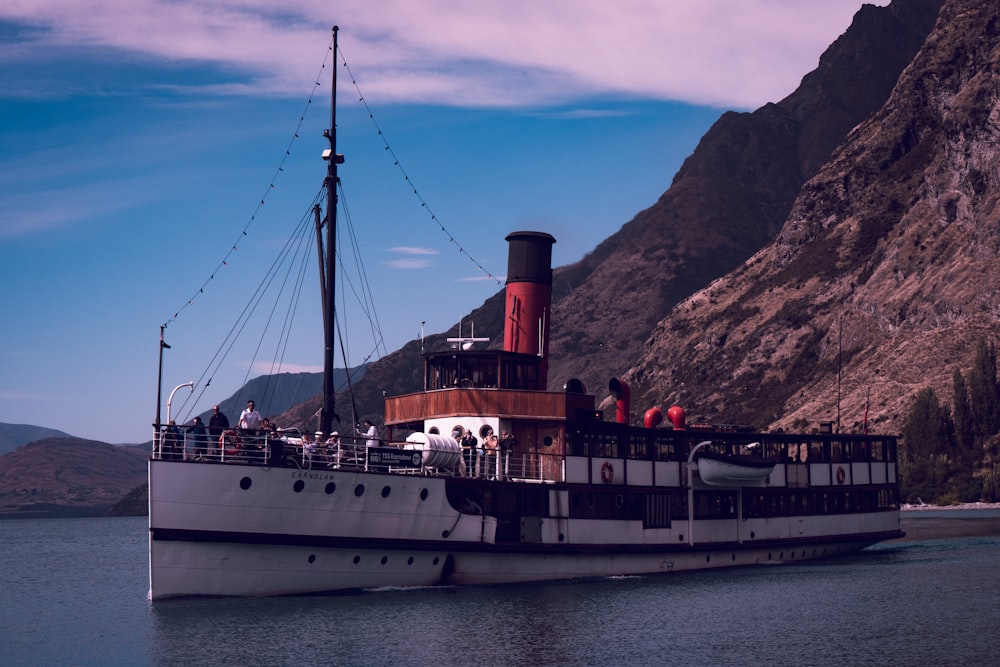 a large boat floating on top of a body of water