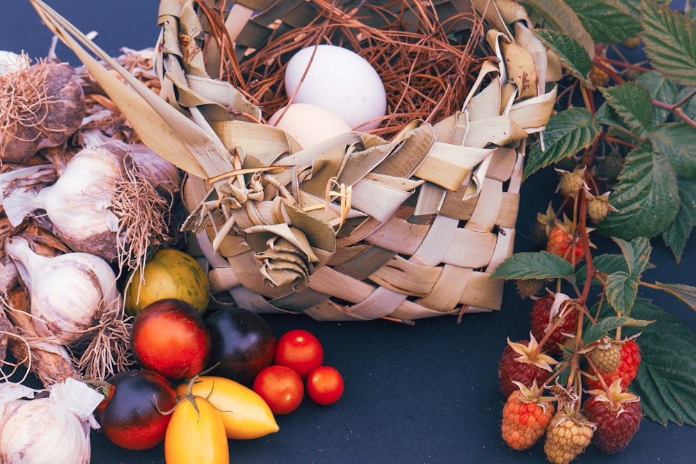 a basket filled with lots of different types of fruits and vegetables