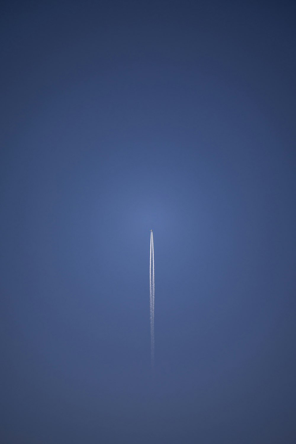 an airplane is flying in the sky at night