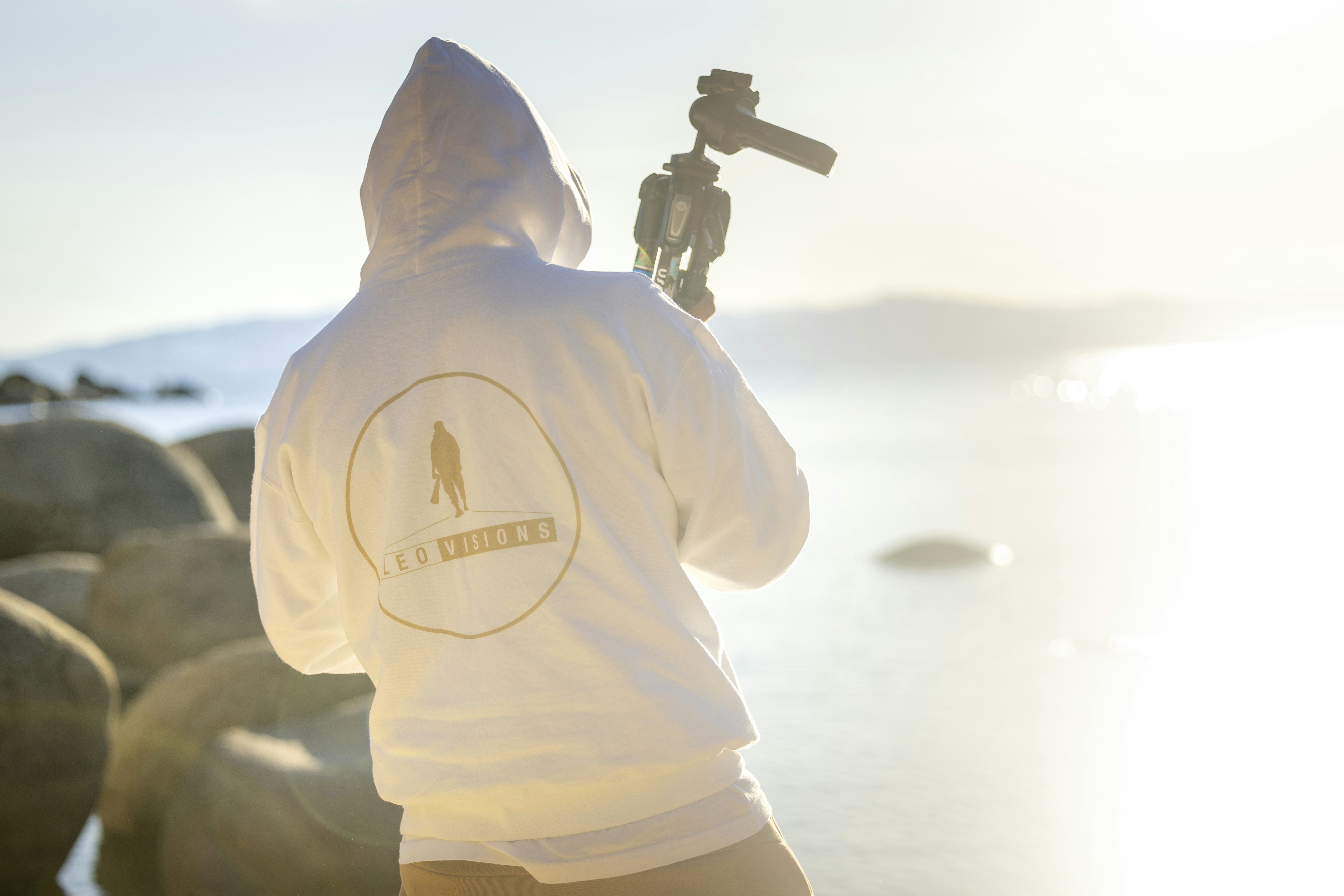 a person with a camera on a beach