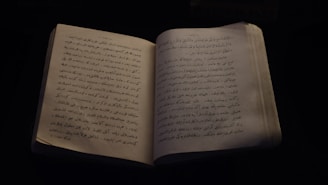 an open book with arabic writing on it