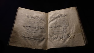 an open book with arabic writing on it