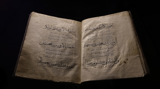 an open book with arabic writing on it