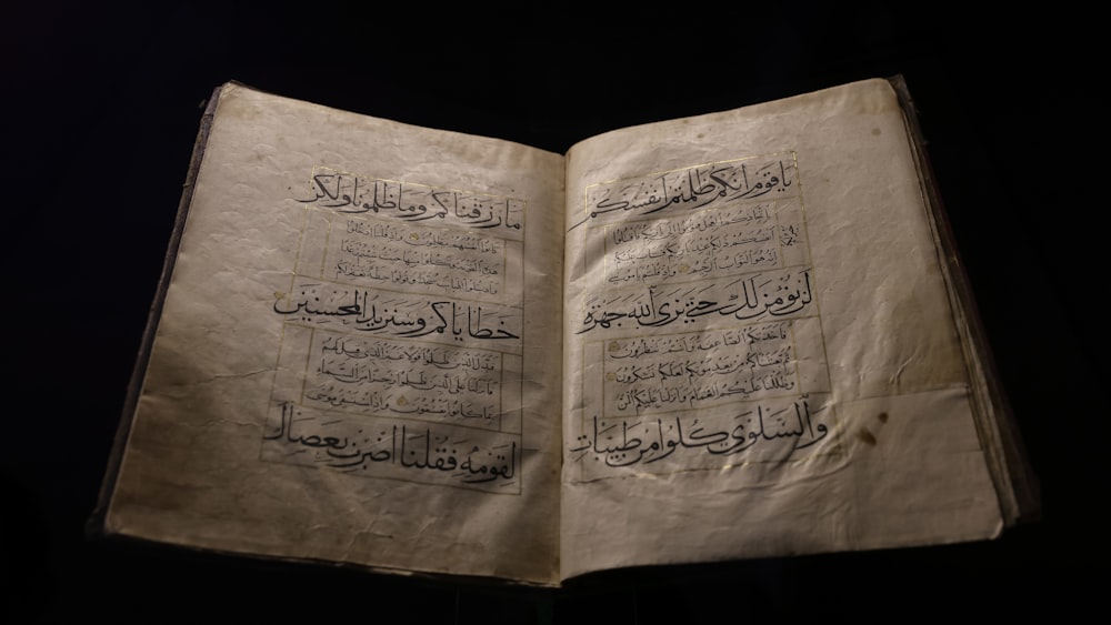 an open book with arabic writing on it