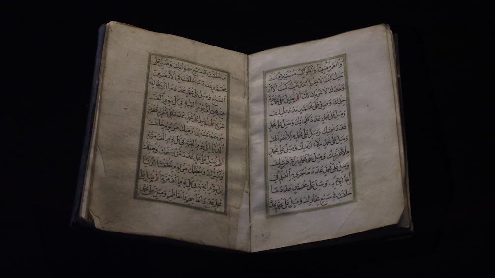 an open book with arabic writing on it