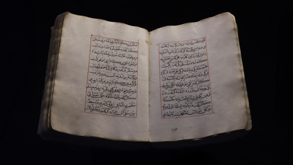 an open book with arabic writing on it