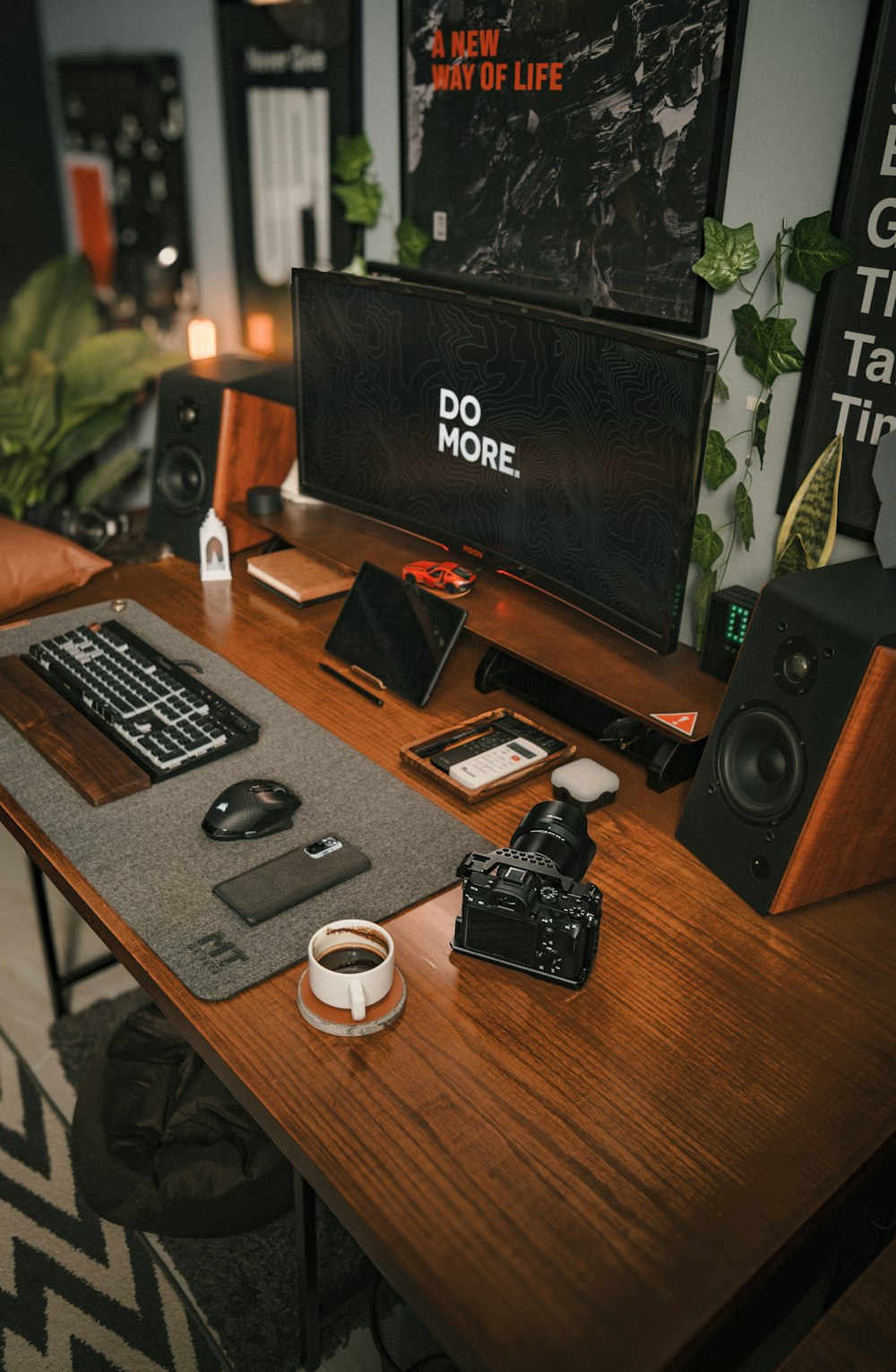 a wooden desk topped with a computer monitor and keyboard