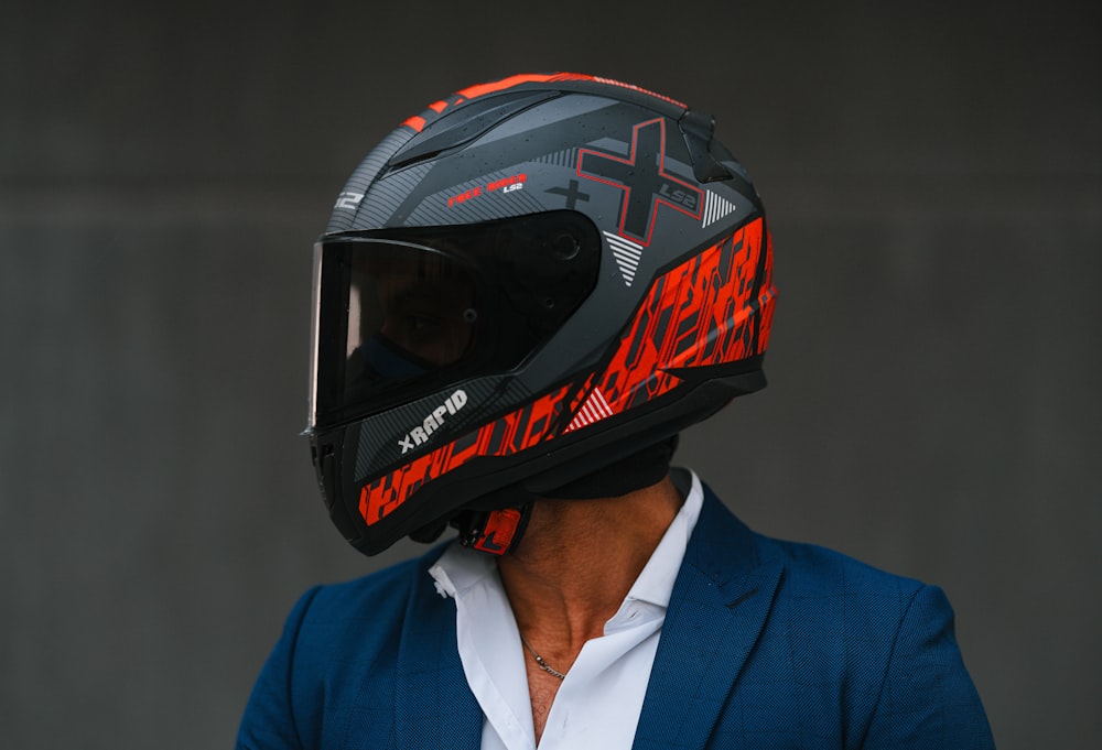 a man in a suit and a motorcycle helmet