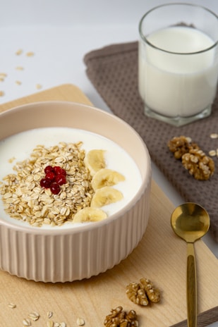 a bowl of oatmeal and a glass of milk