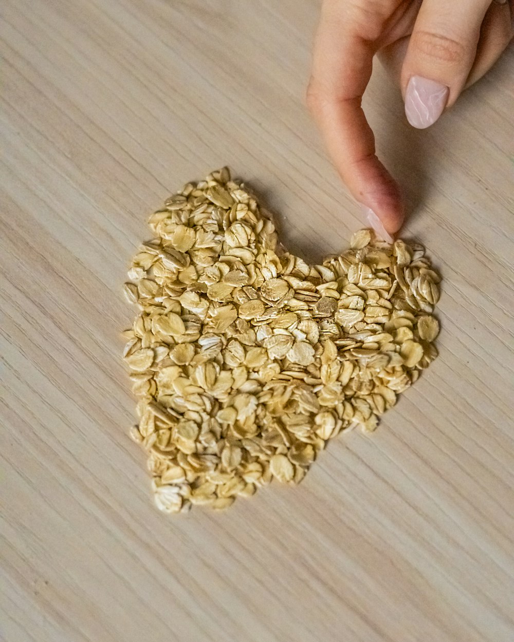 a heart shaped piece of oatmeal on a table