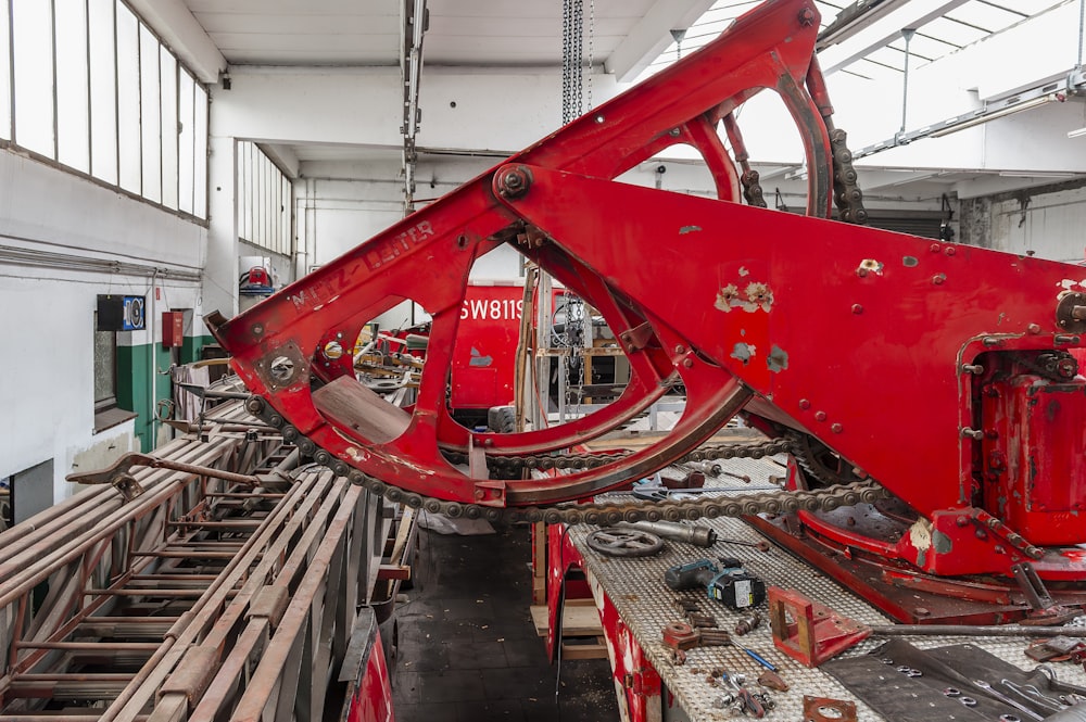 a large red machine in a large building