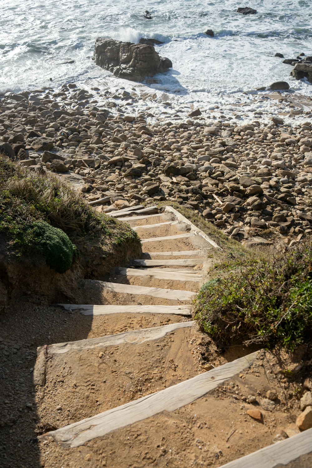 a set of stairs leading down to the beach