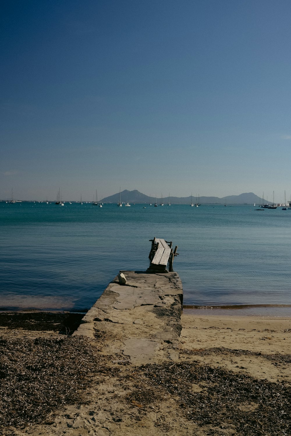 a boat is sitting on a dock in the water