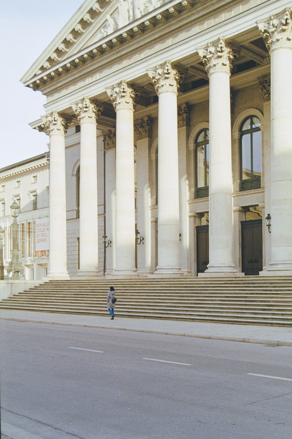 a person standing in front of a large building