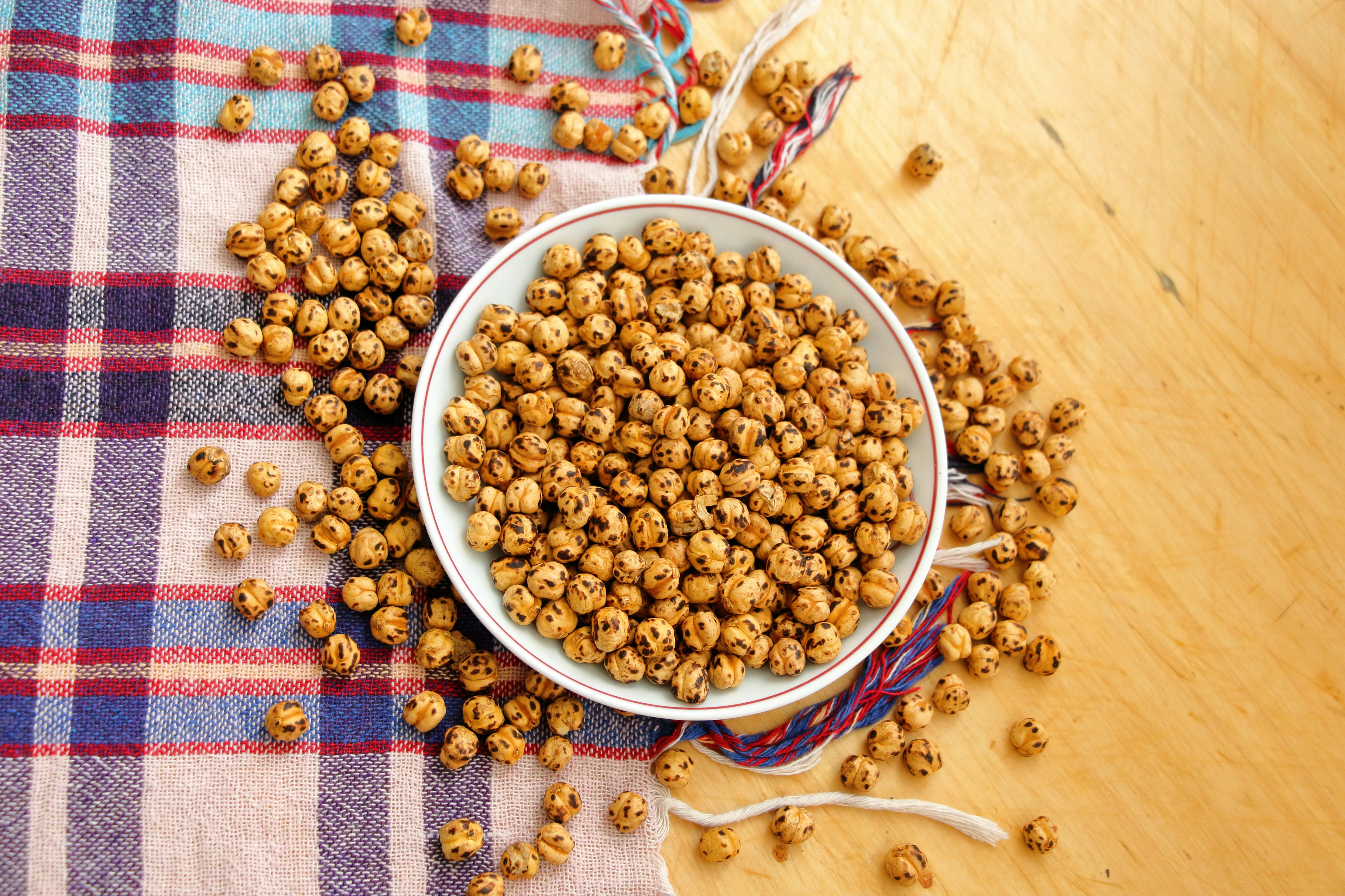 a bowl filled with cereal sitting on top of a table