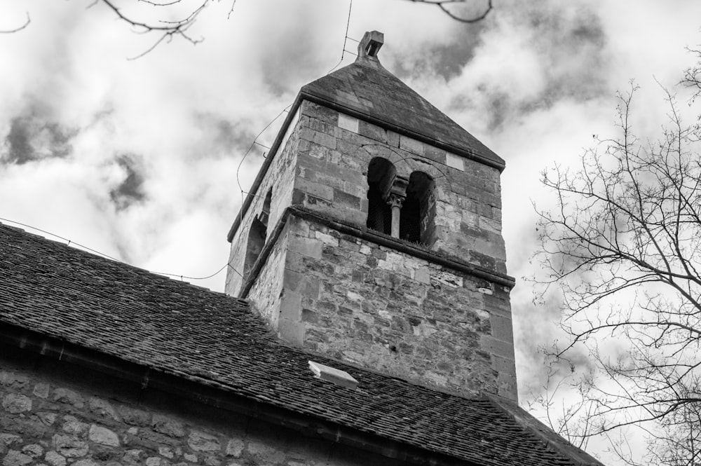 a black and white photo of a church tower