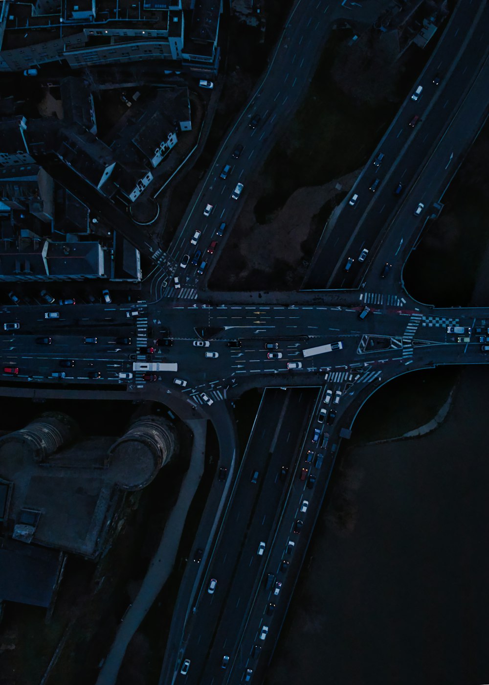 an aerial view of a city intersection at night