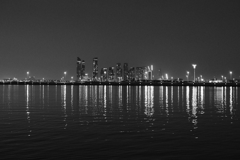 a black and white photo of a city at night