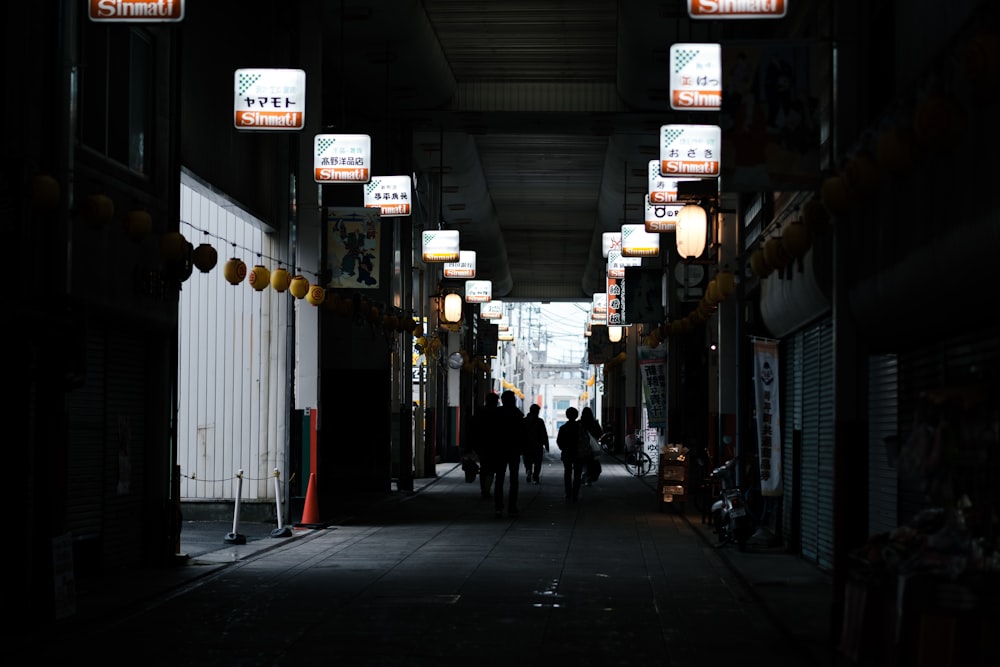 a couple of people that are walking down a street