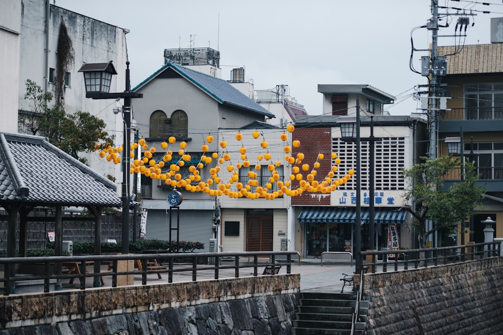 a bunch of orange balloons floating in the air